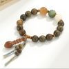 Large Bead Green Sandalwood Bracelet with Lotus Carvings & Tassel – Spiritual Renewal