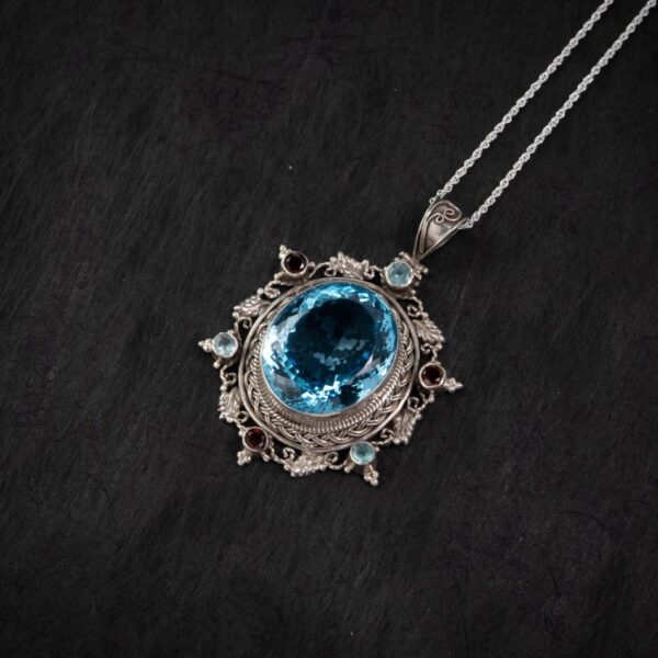 Blue Topaz Starburst Silver Pendant – Clarity & Expression