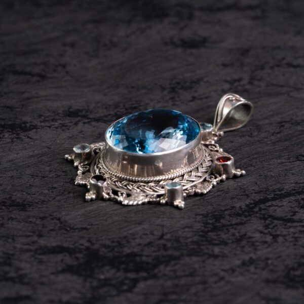 Blue Topaz Starburst Silver Pendant – Clarity & Expression
