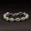 Peridot Blossom Halo Silver Bracelet – Prosperity & Renewal