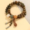 Double-Wrap Wooden Mala Bracelet with Lotus Carvings & Tassel – Spiritual Balance