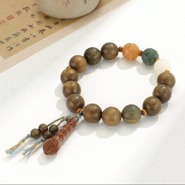 Large Bead Green Sandalwood Bracelet with Lotus Carvings & Tassel – Spiritual Renewal