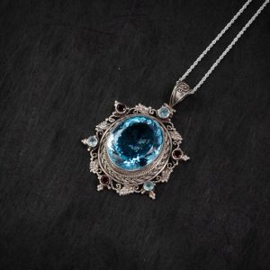 Blue Topaz Starburst Silver Pendant – Clarity & Expression